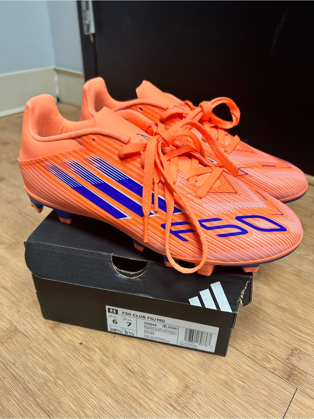 adidas Kids Neon Orange Soccer Cleats with Blue Accents